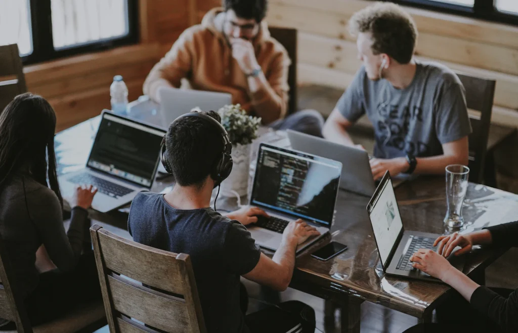 Multi-disciplinary engineering team collaborating in a modern office