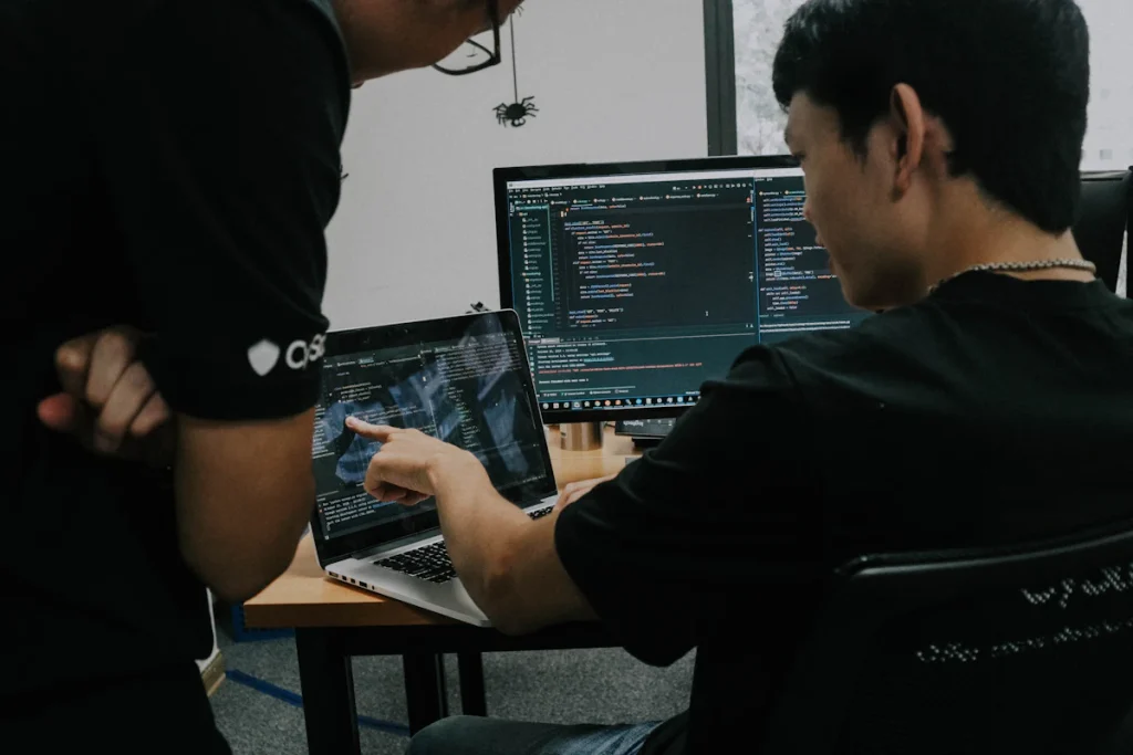Engineer reviewing technical project plans on a laptop