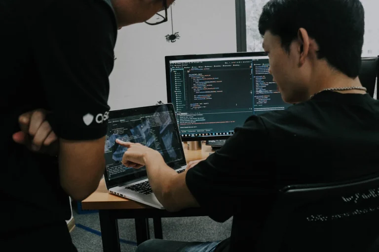Engineer reviewing technical project plans on a laptop